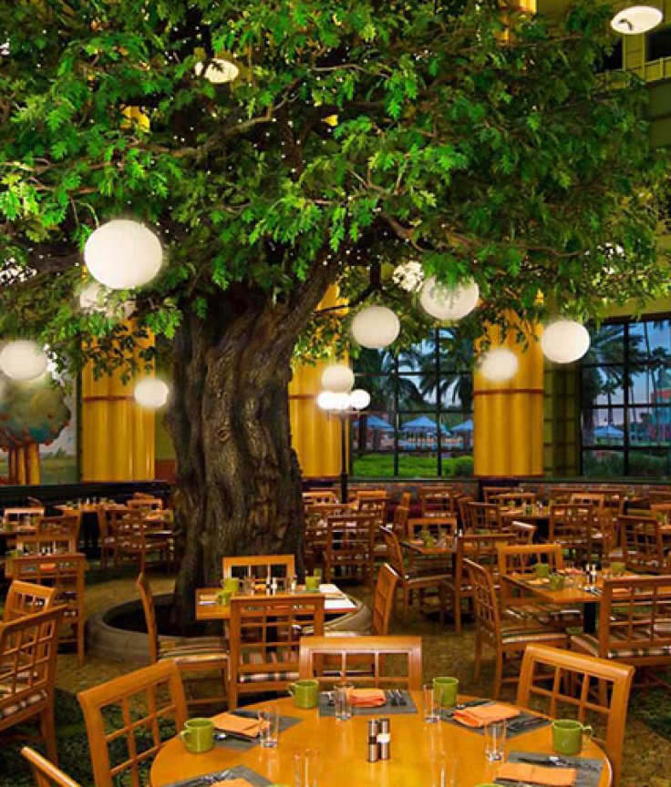 Garden Grove Dining Room with Tree, Tables and Chairs at the Walt Disney World Swan Resort